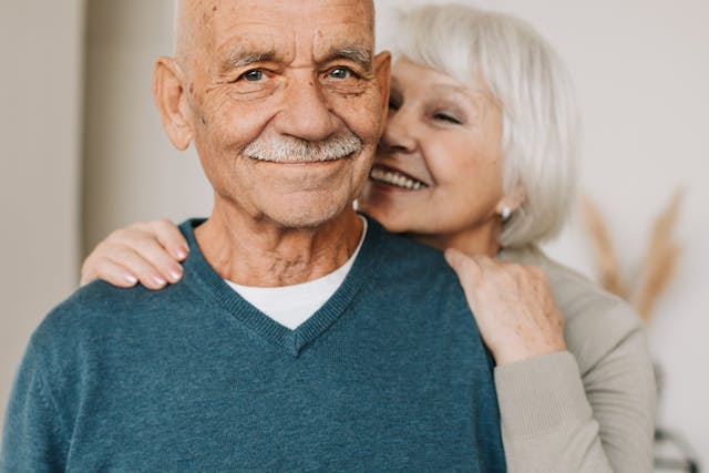 sandwich generation, long-term care, image of a senior man and woman smiling