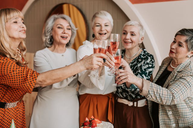 legacy planning, image of senior women raising a toast