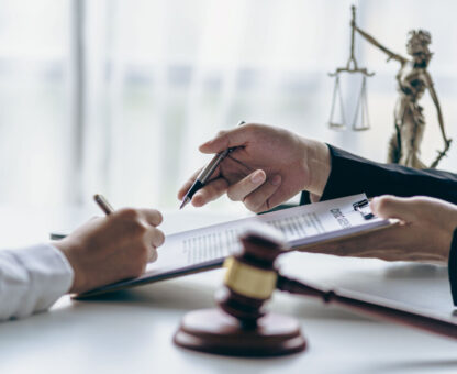 client meeting with attorney reviewing documents, related to estate planning and trust management