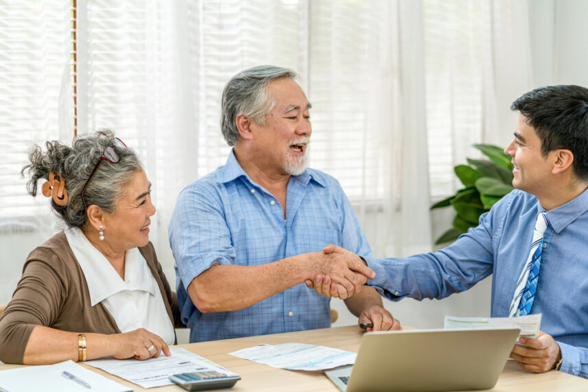 elder couple talking with estate planning attorney