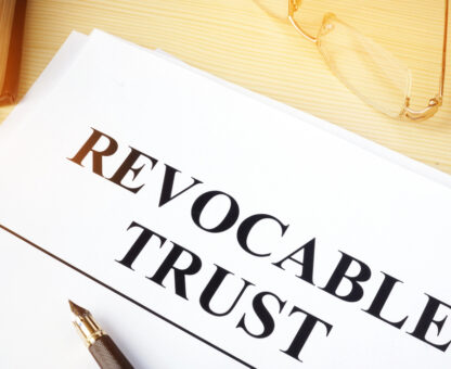 copy of a revocable trust on a desk