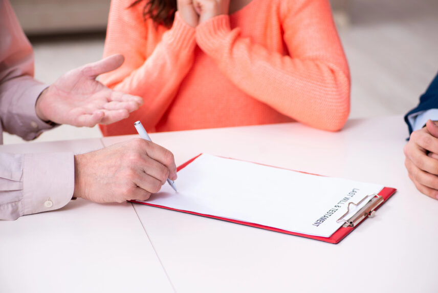 lawyer reviewing last will and testament with couple