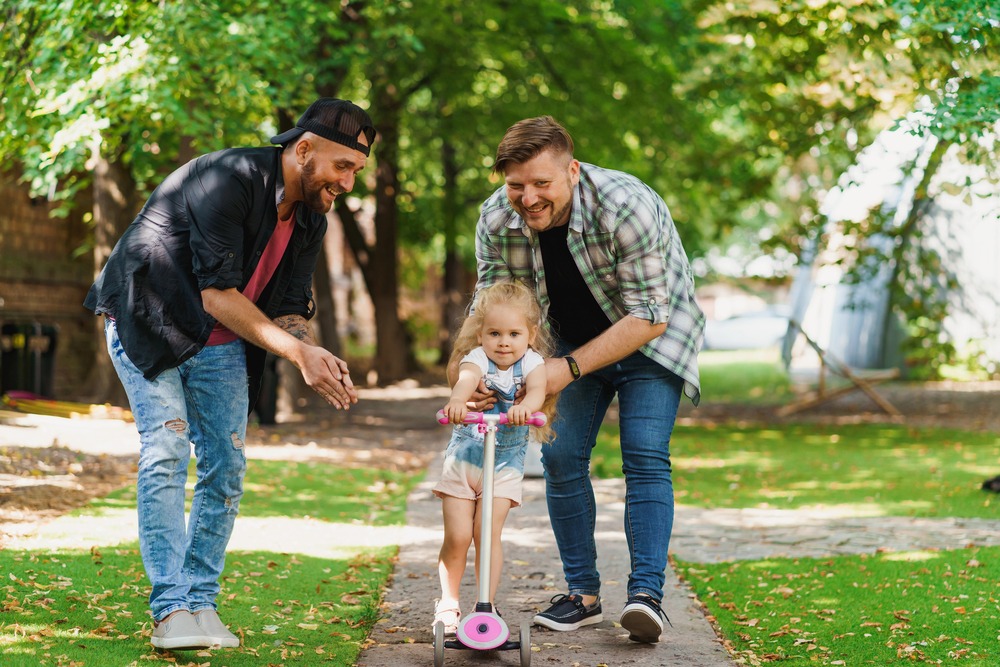 gay parents with child emphasizing the importance of lgbtq estate planning