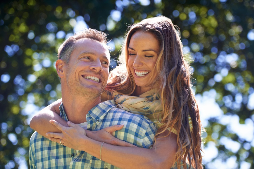 couple in embrace smiling